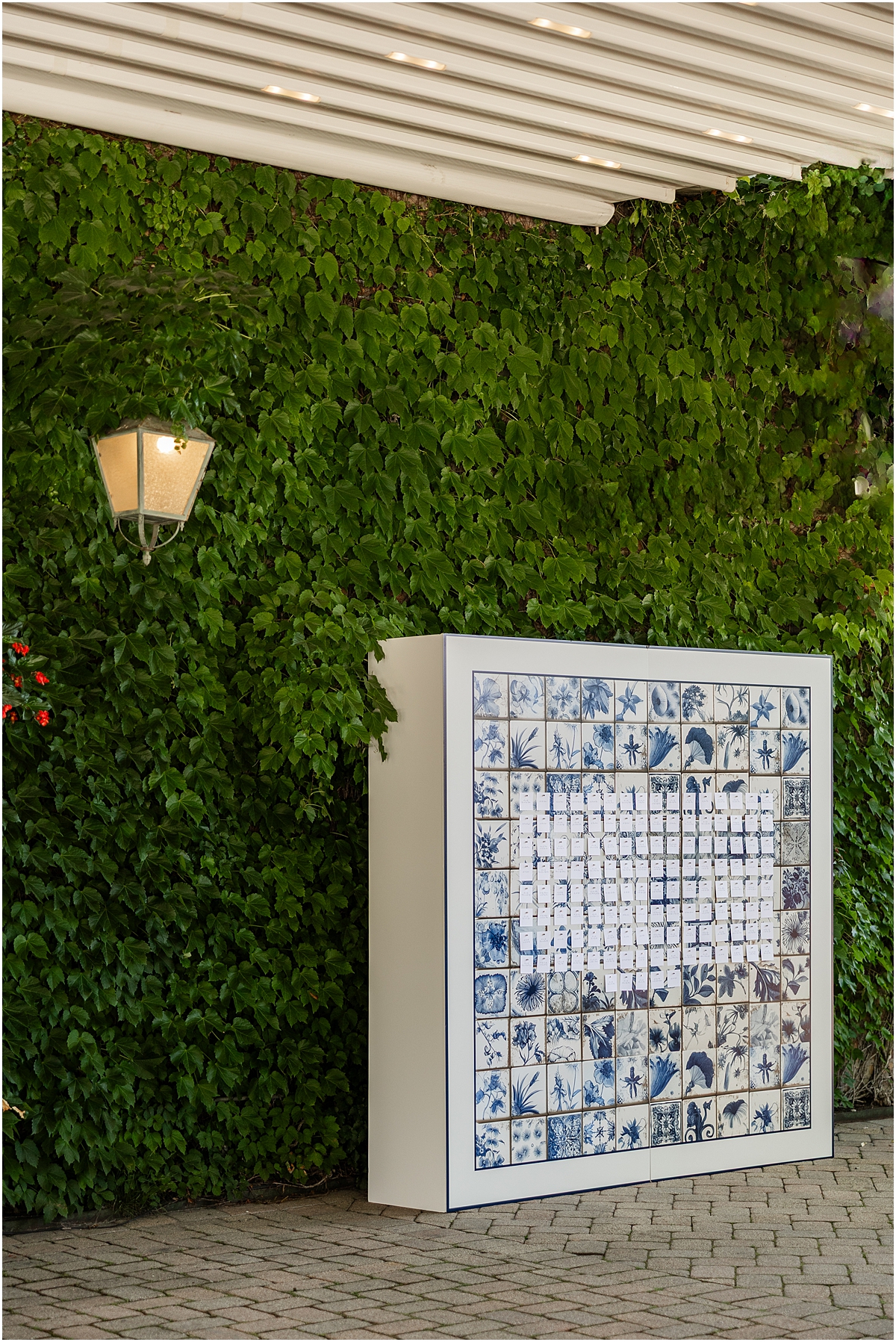 custom seating chart surrounded by greenery
