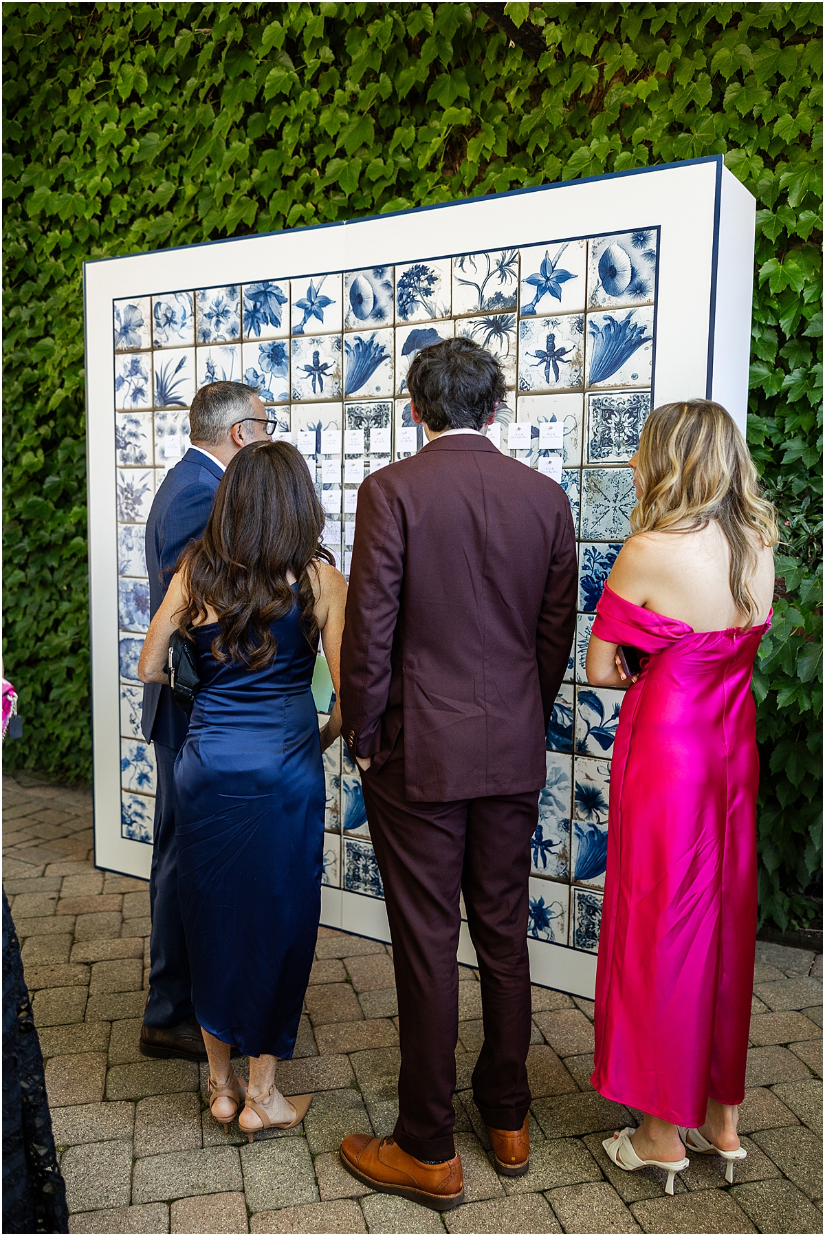 wedding guests looking at seating chart