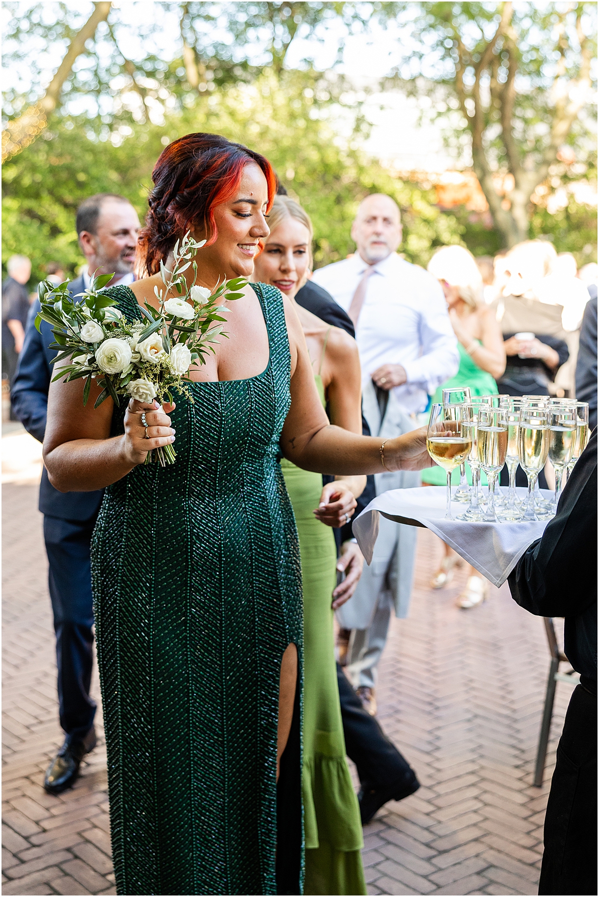 bridesmaid takes glass of champagne