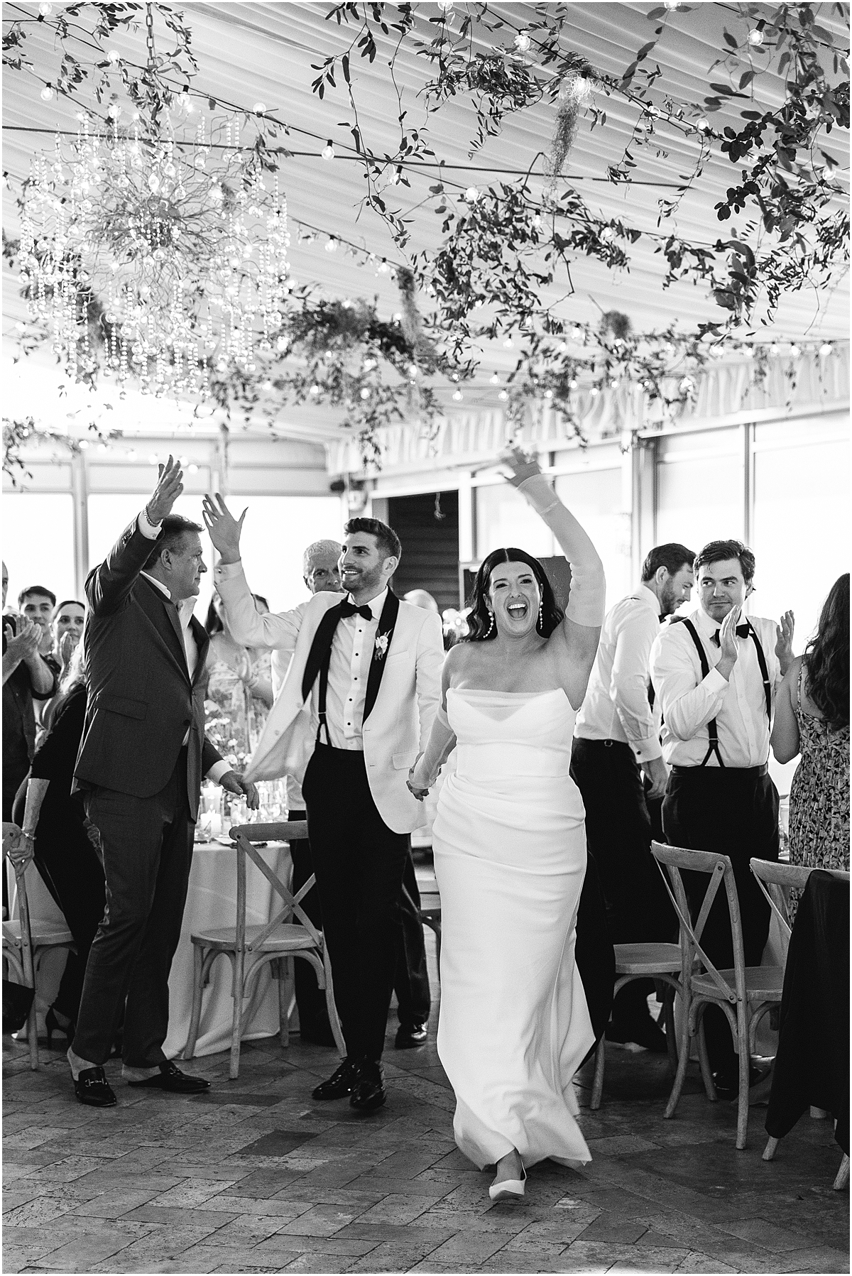 newlyweds enter reception space