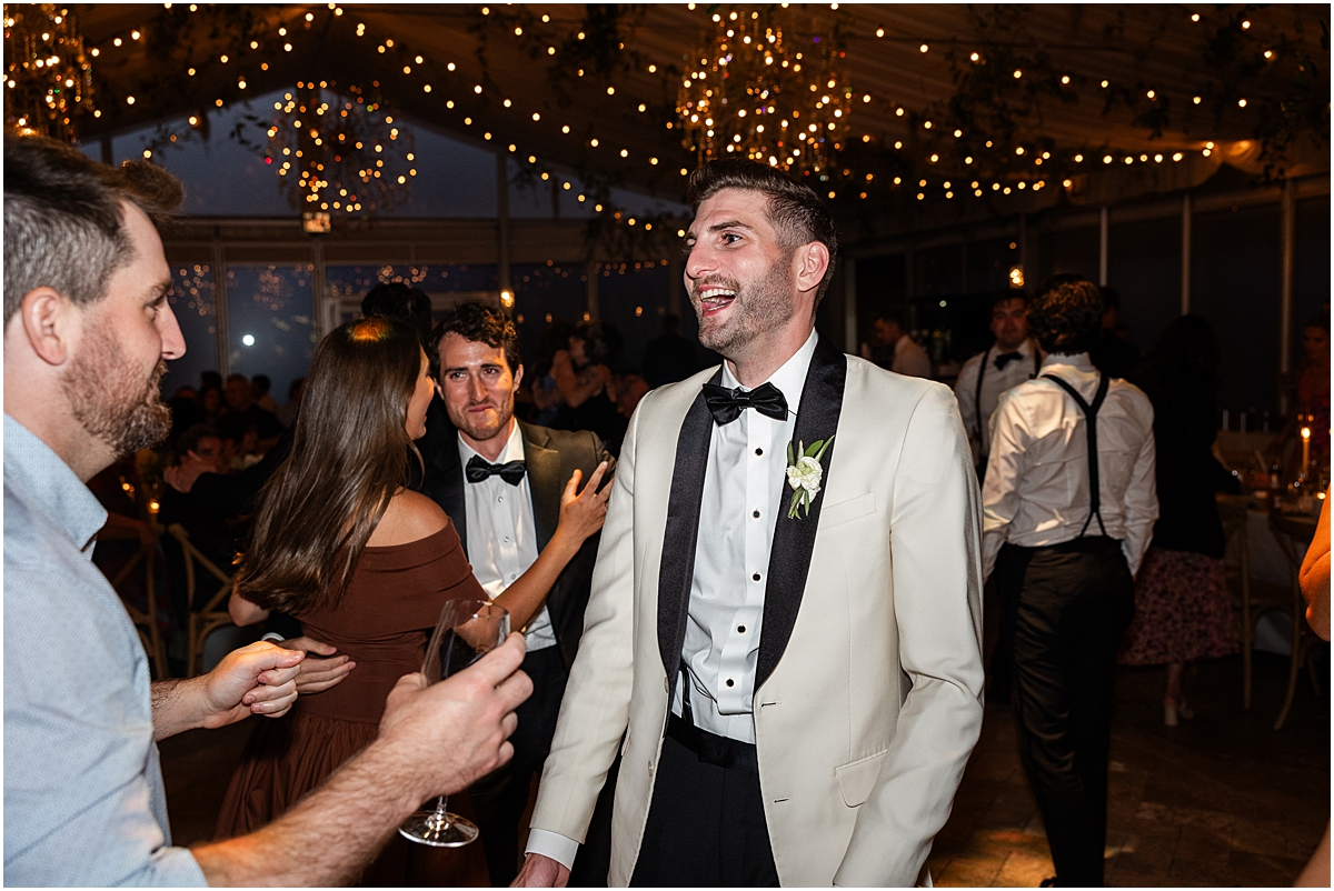 groom dances at wedding reception