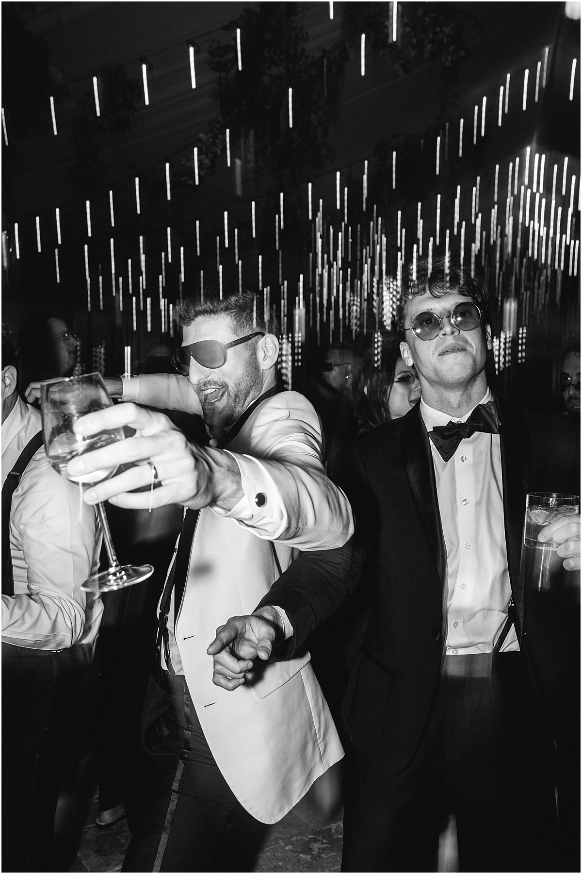 groom and groomsmen on dance floor