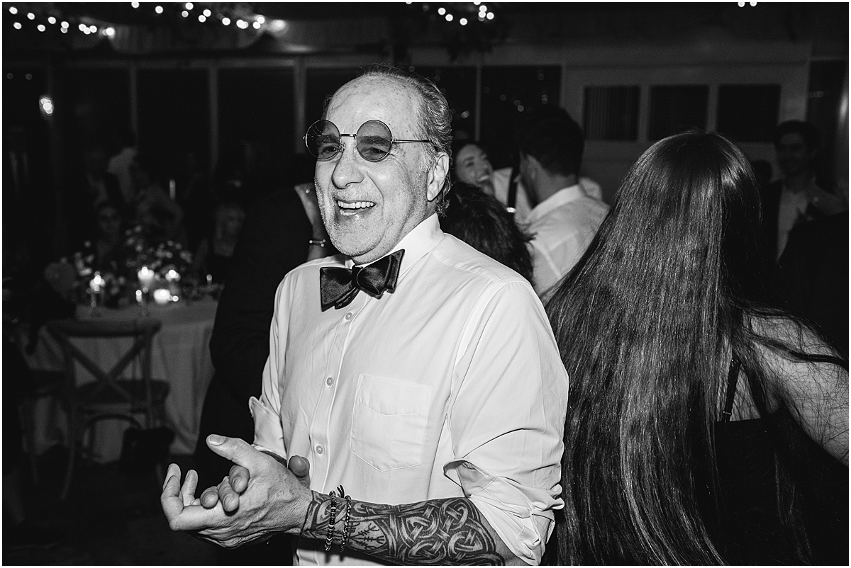 man on dance floor wearing sunglasses