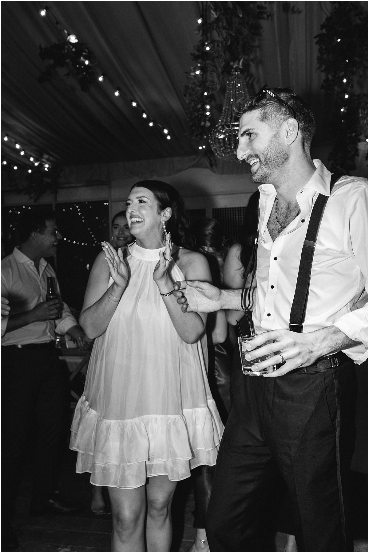 newlyweds laugh on the dance floor