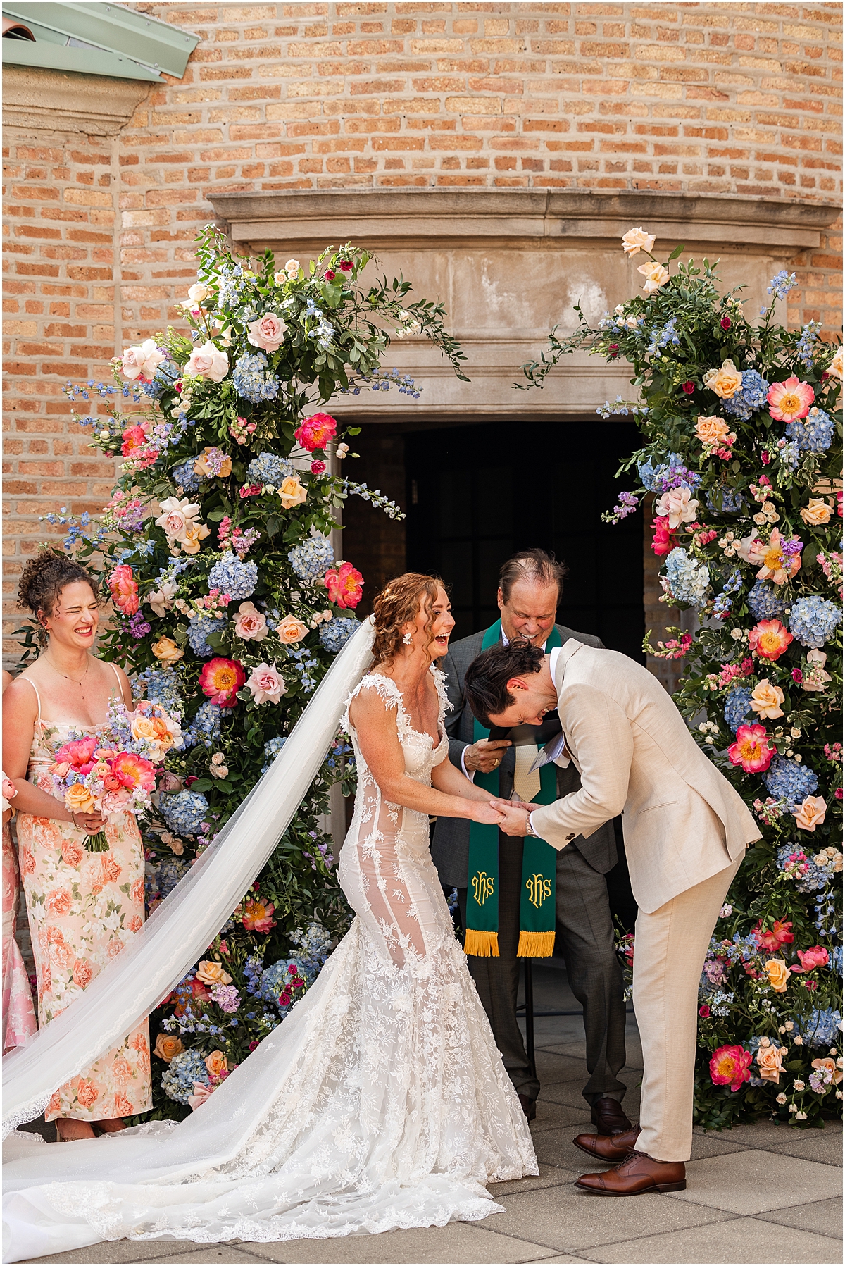 candid photo of couple laughing during wedding ceremony at Revel Motor Row