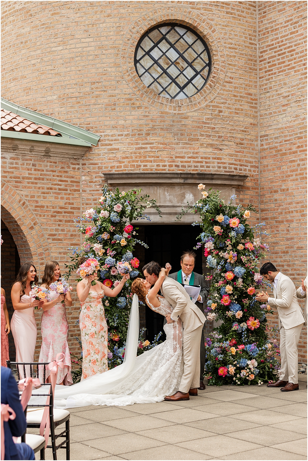 bride and groom kiss at altar
