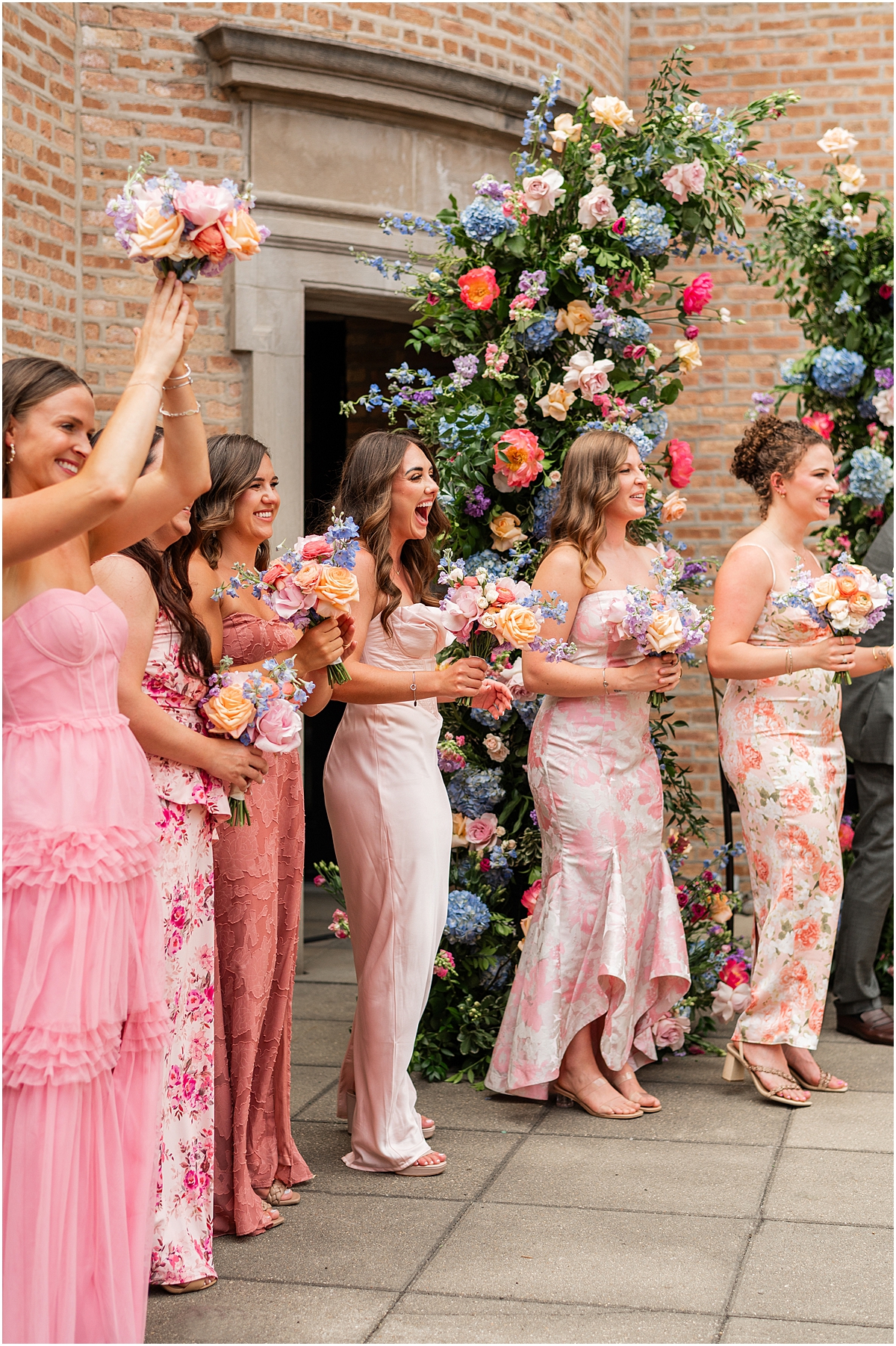 bridesmaids cheer as couple is announced as husband and wife