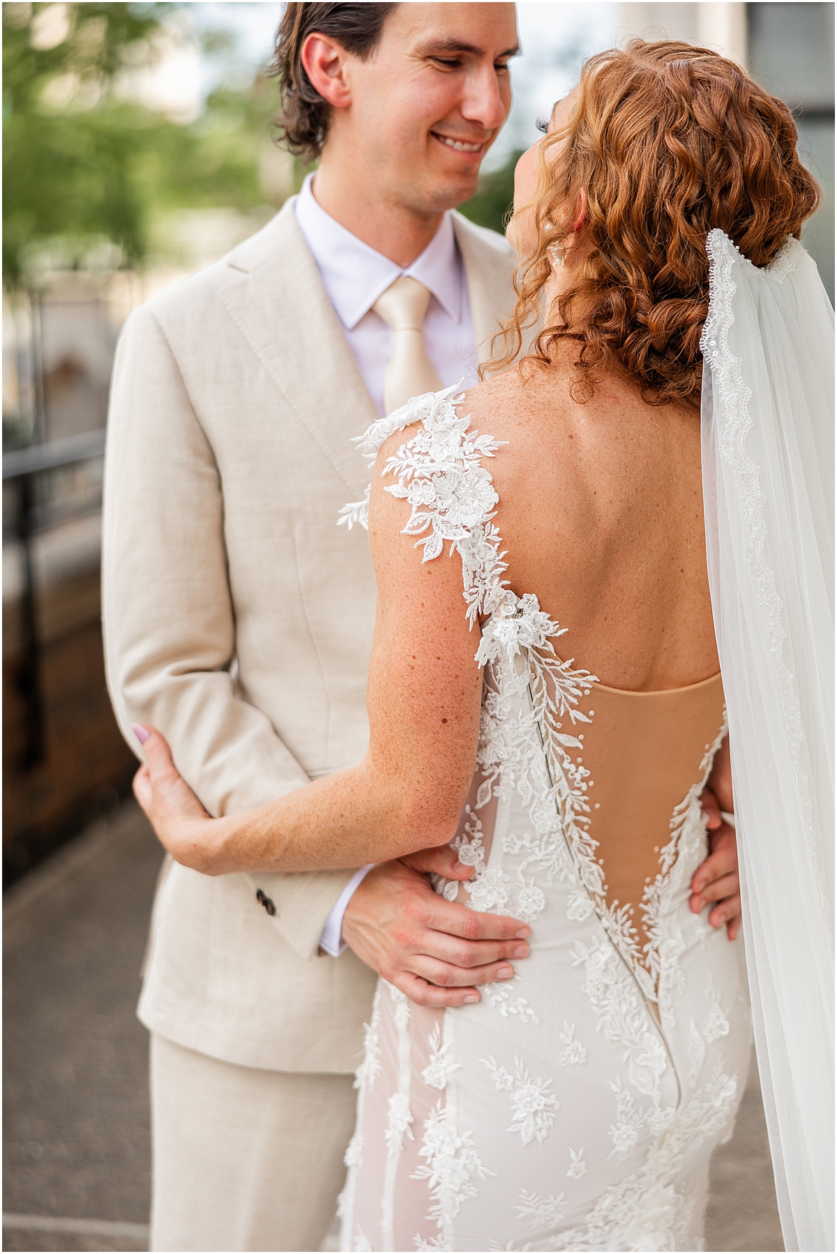 newlyweds look up at each other