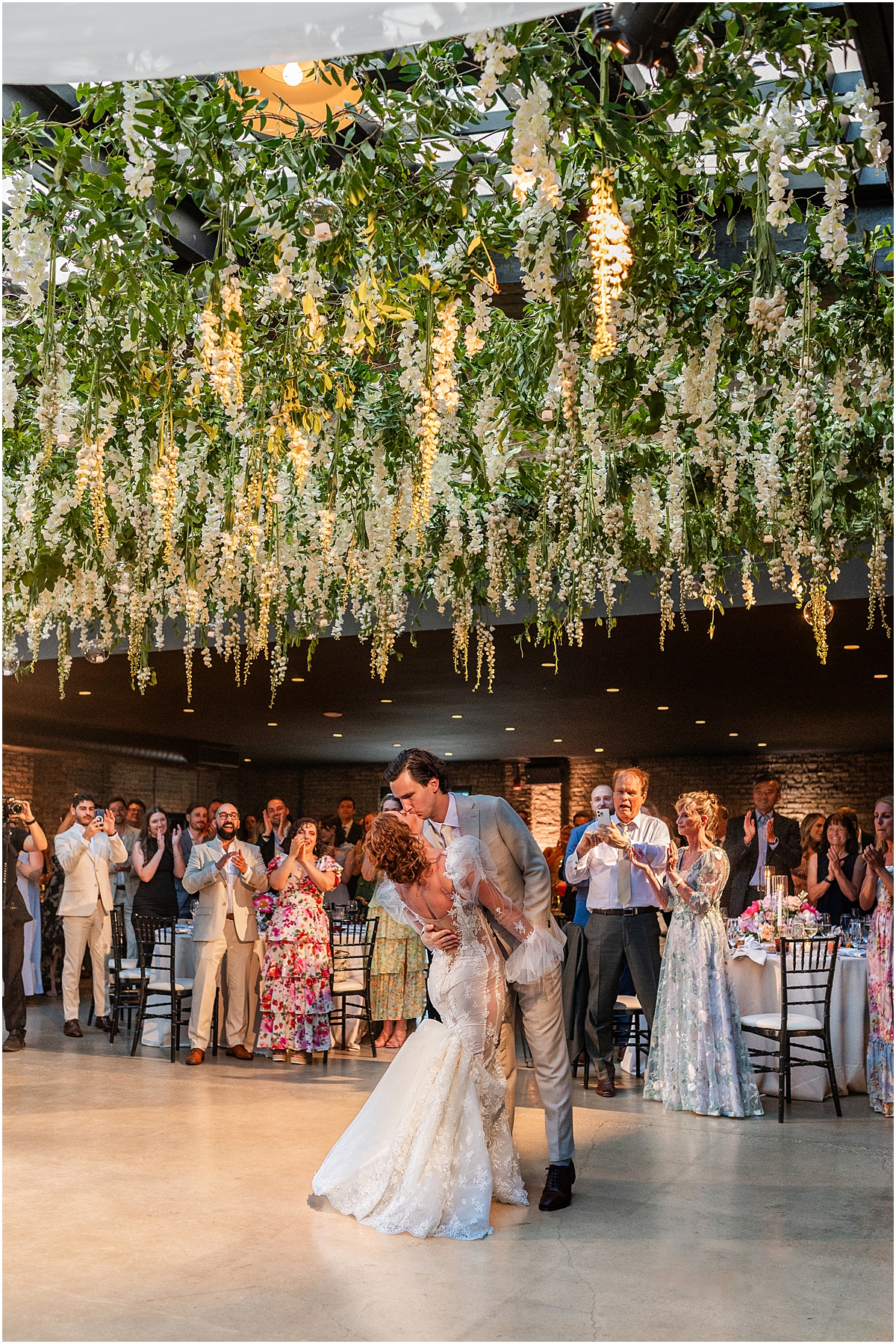 bride and groom kiss on the dance floor