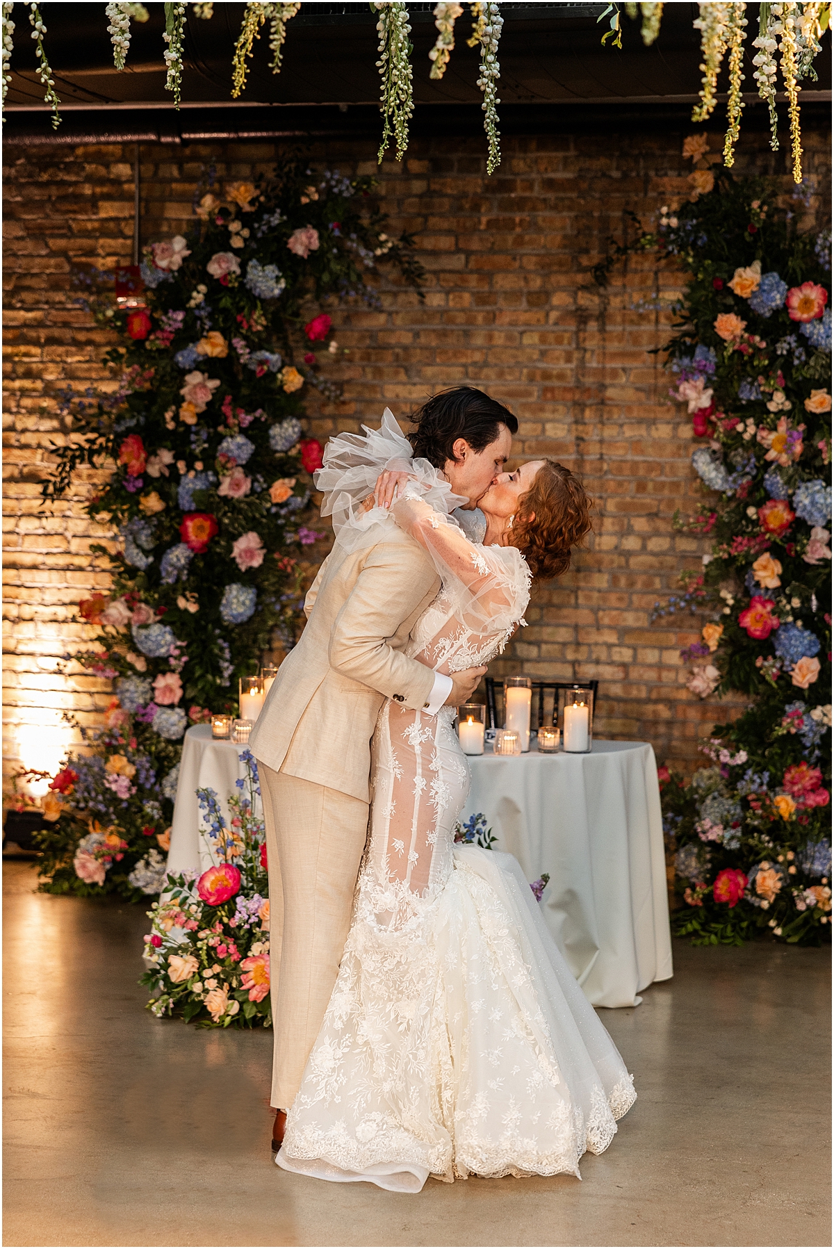 newlyweds kiss at wedding reception
