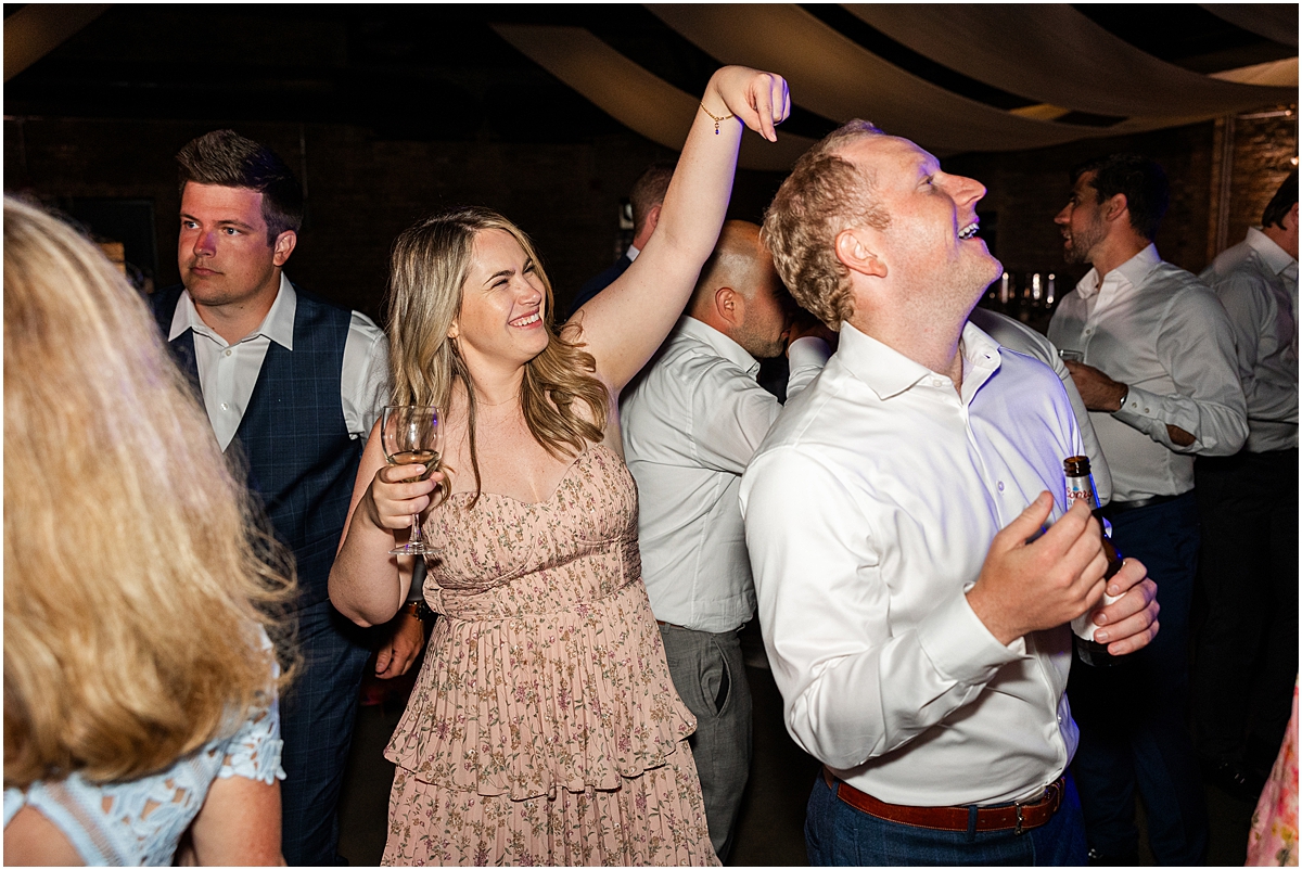 candid photos of guests on dance floor