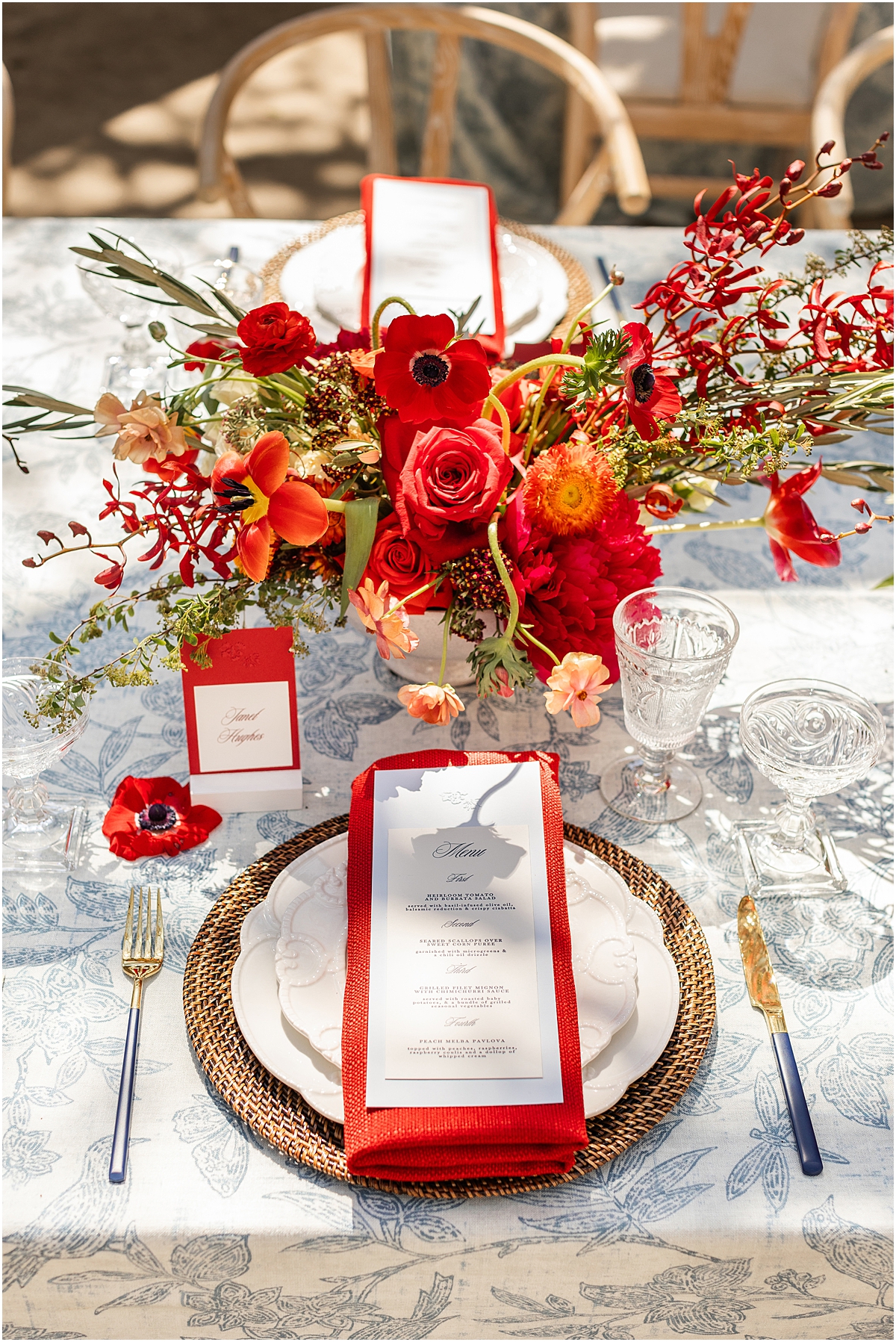 bright red poppy and dusty blue wedding details