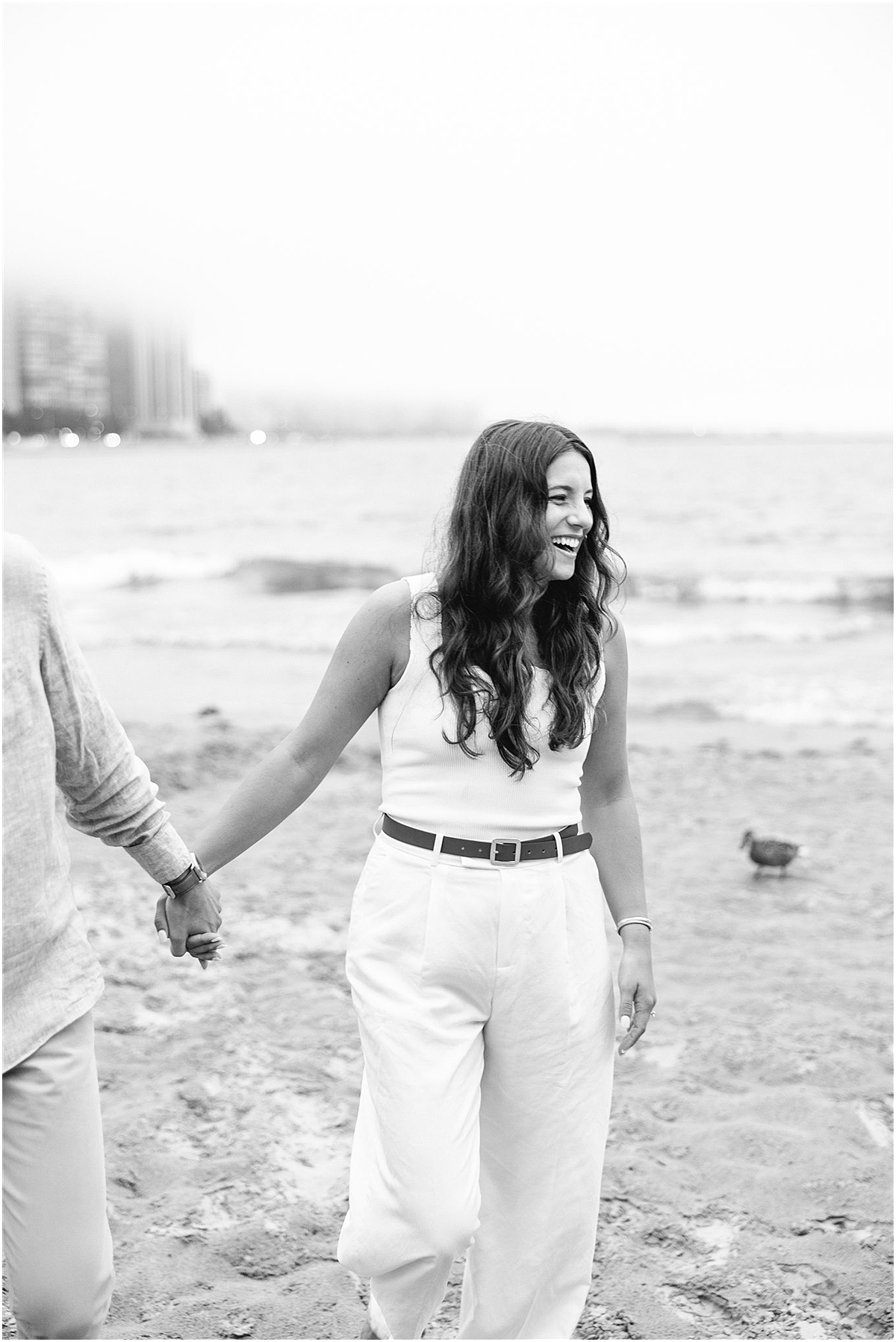 woman laughs with her fiancé