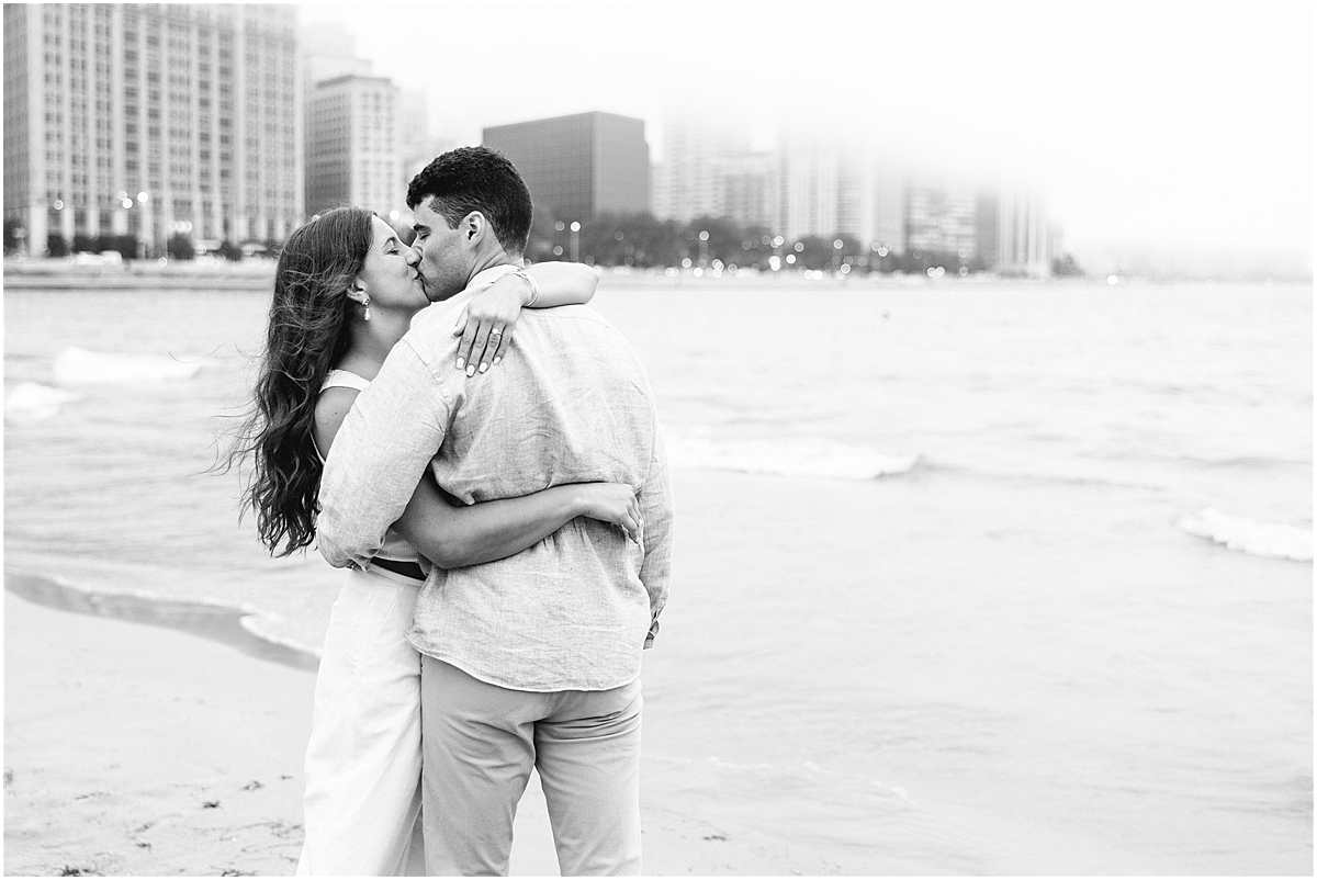 engaged couple kiss at North Avenue Beach during Downtown Chicago Engagement