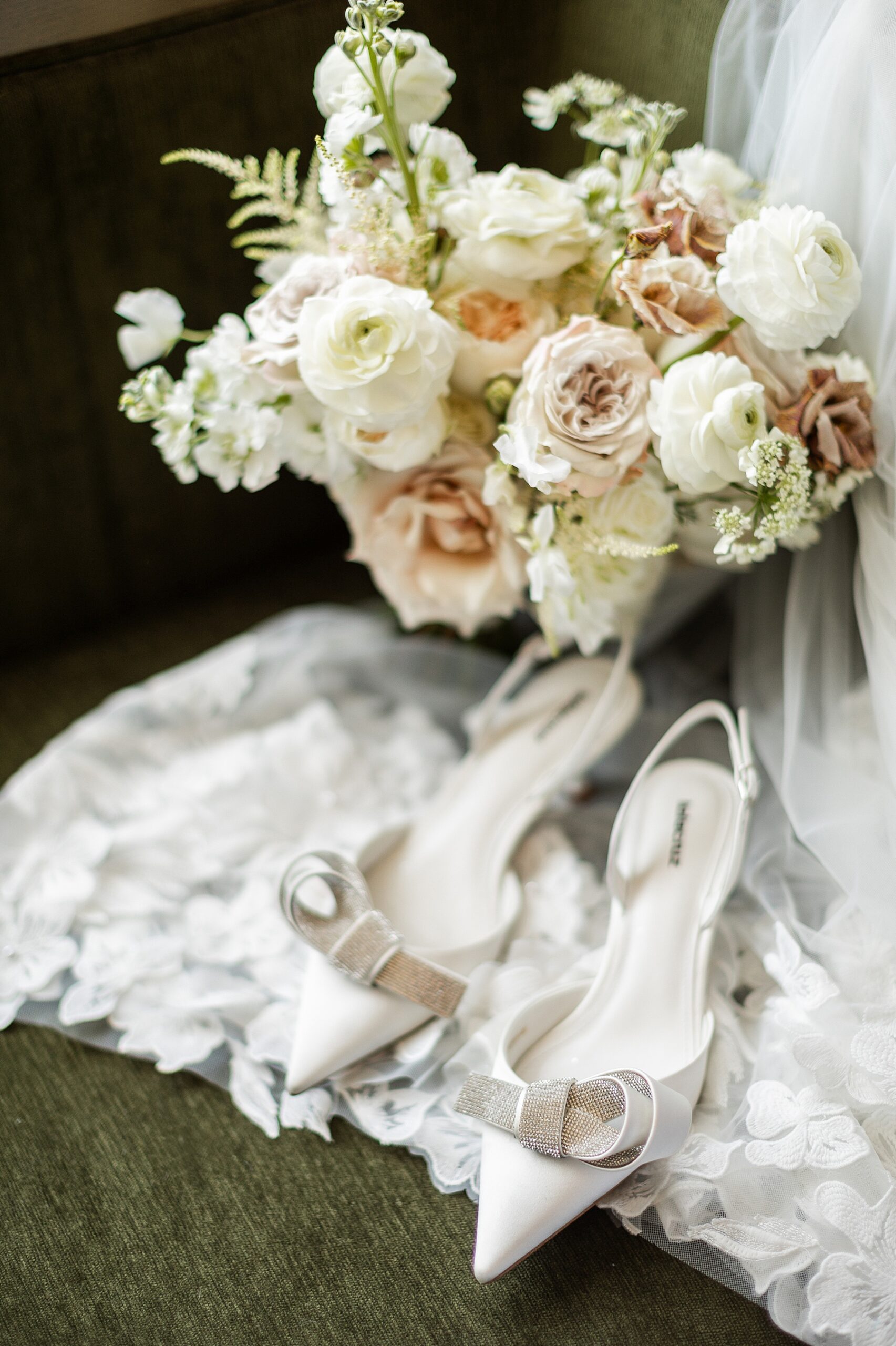 bridal bouquet with bride's wedding shoes
