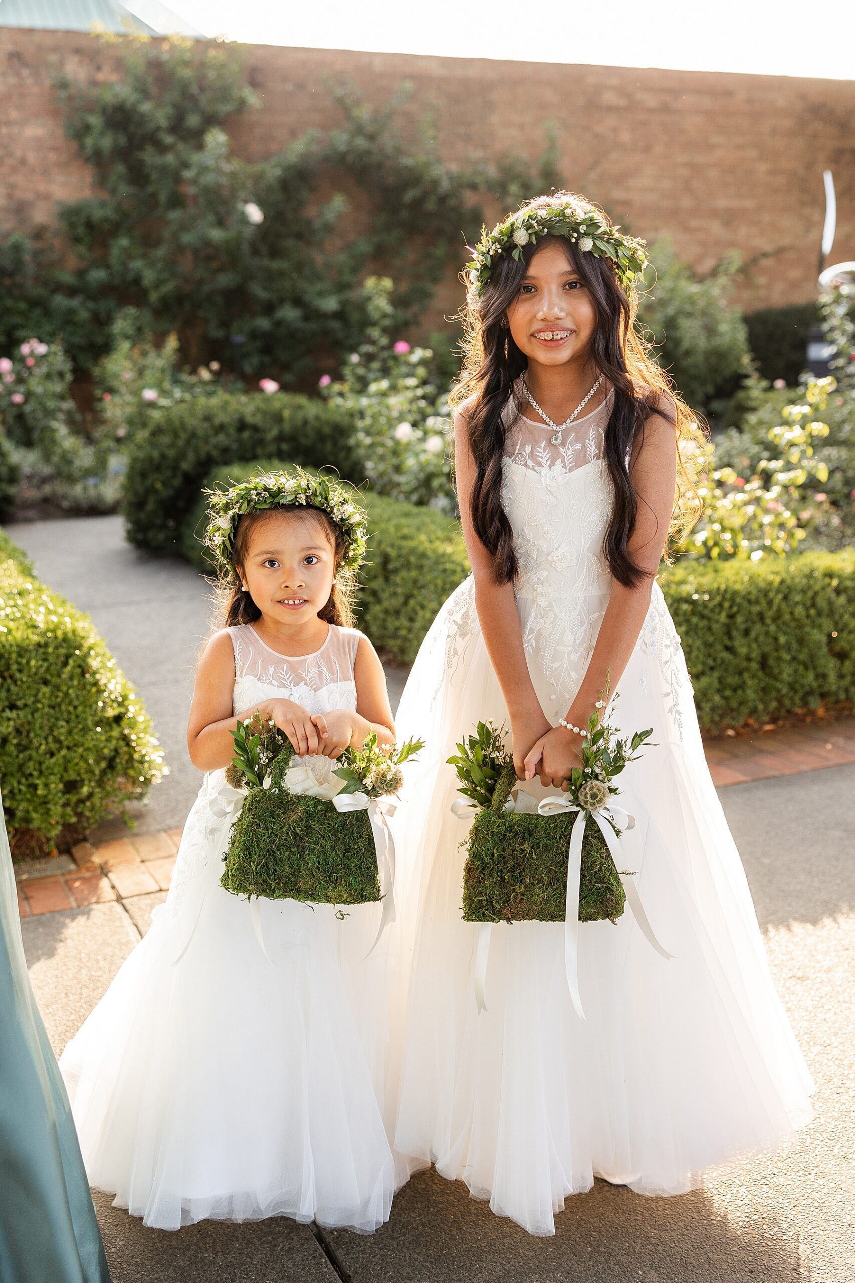 flower girls with flower crowns and garden purses
