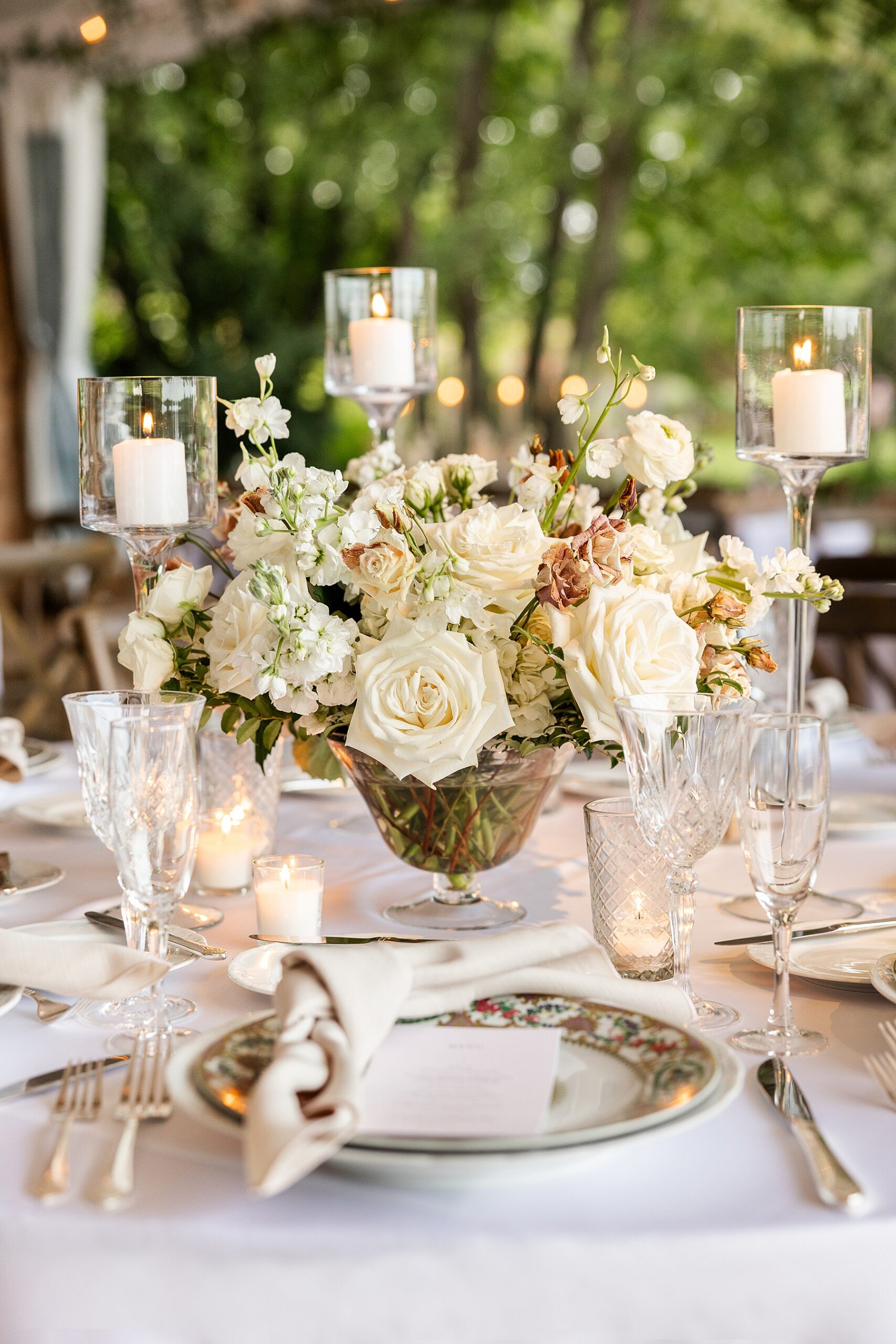 elegant tablescape at tented wedding reception at Chicago Botanic Gardens 