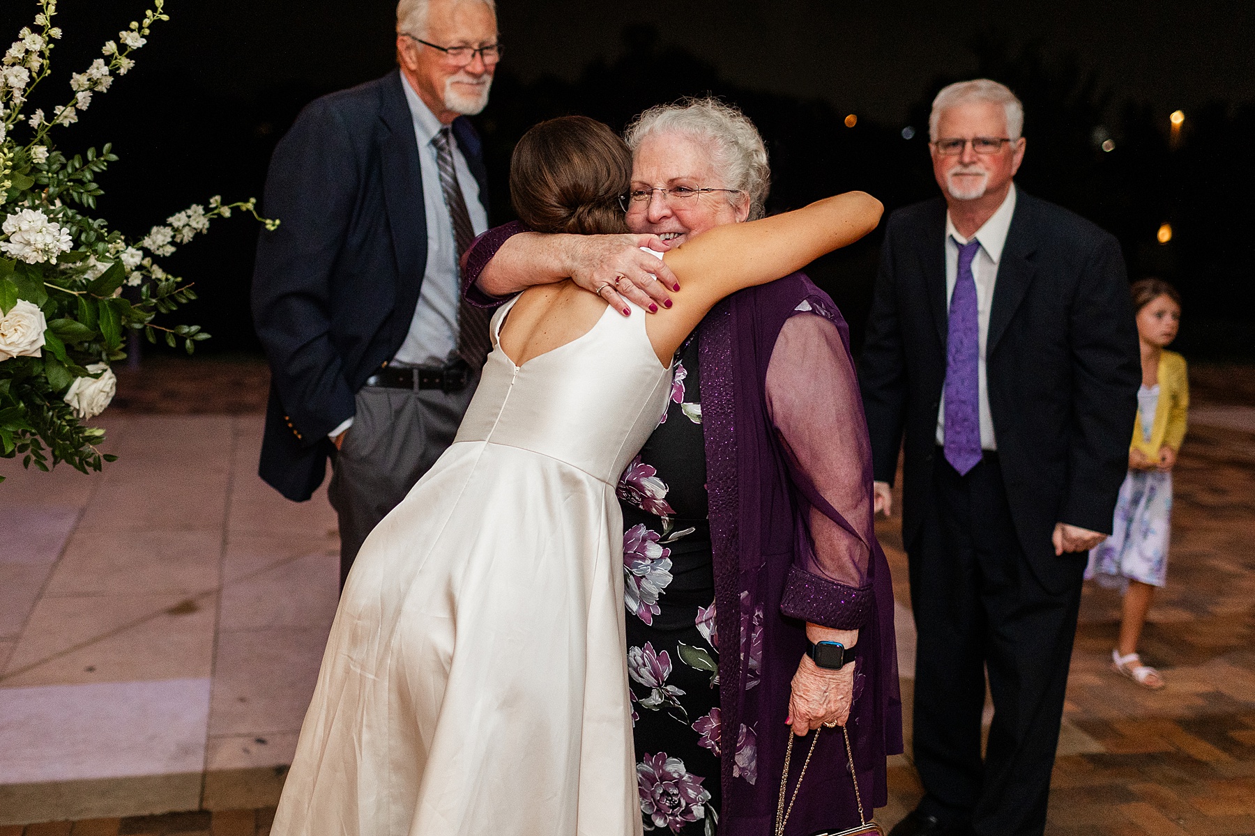 bride hugs family member 