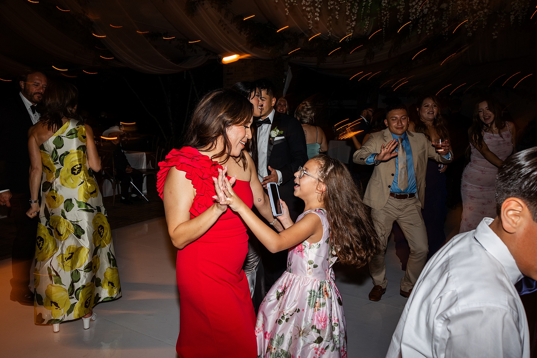 wedding guests celebrate on dance floor