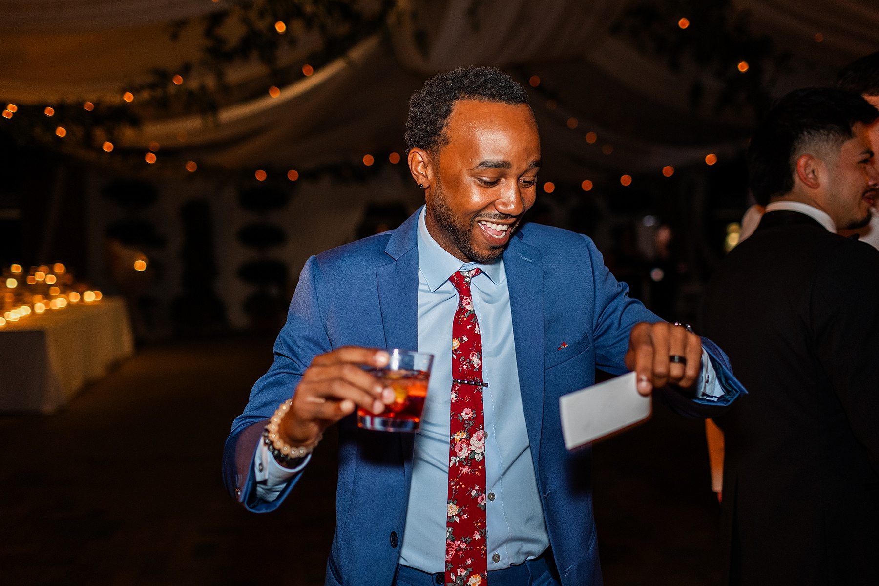 wedding guest laughing on dance floor