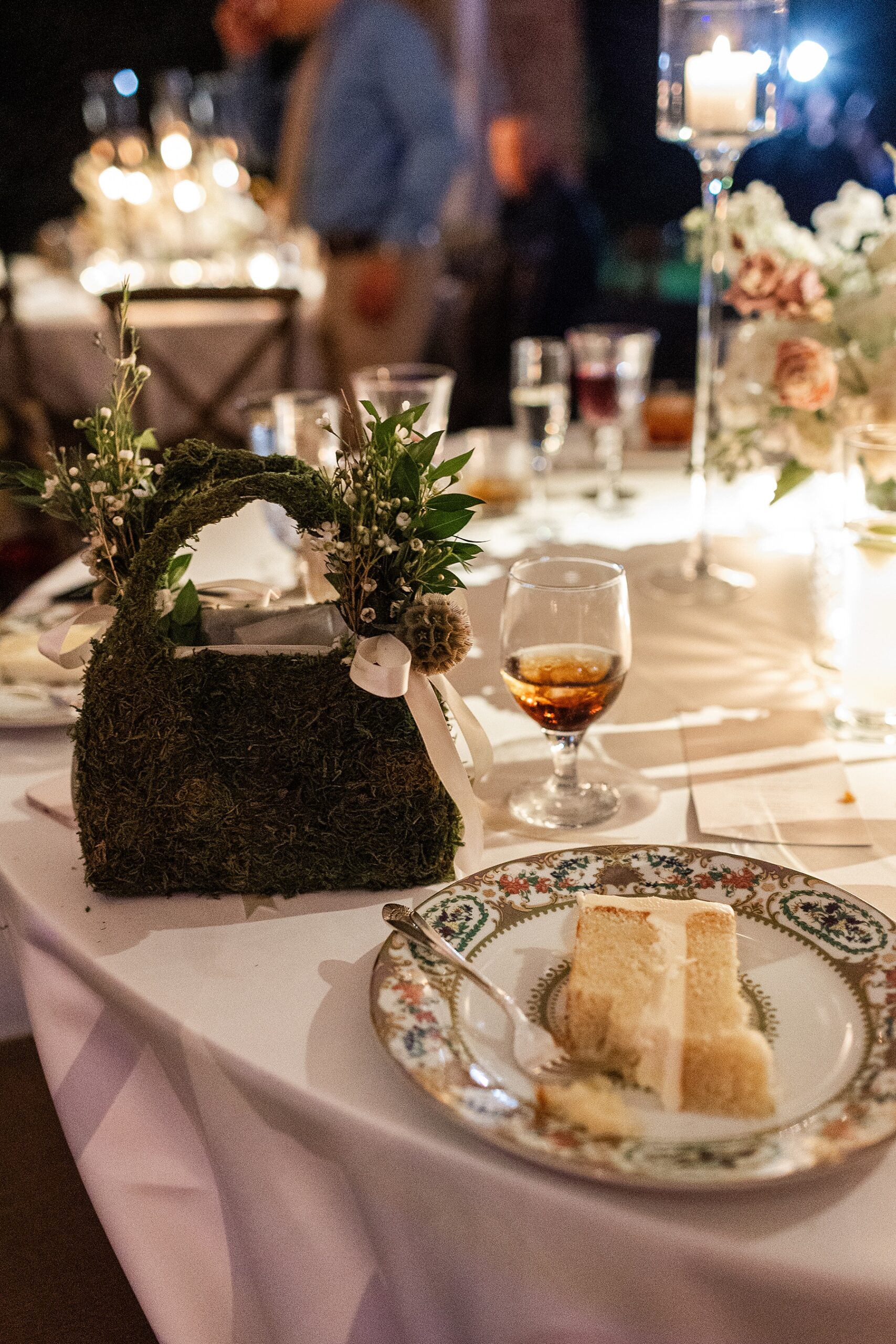 wedding cake at tables at reception 