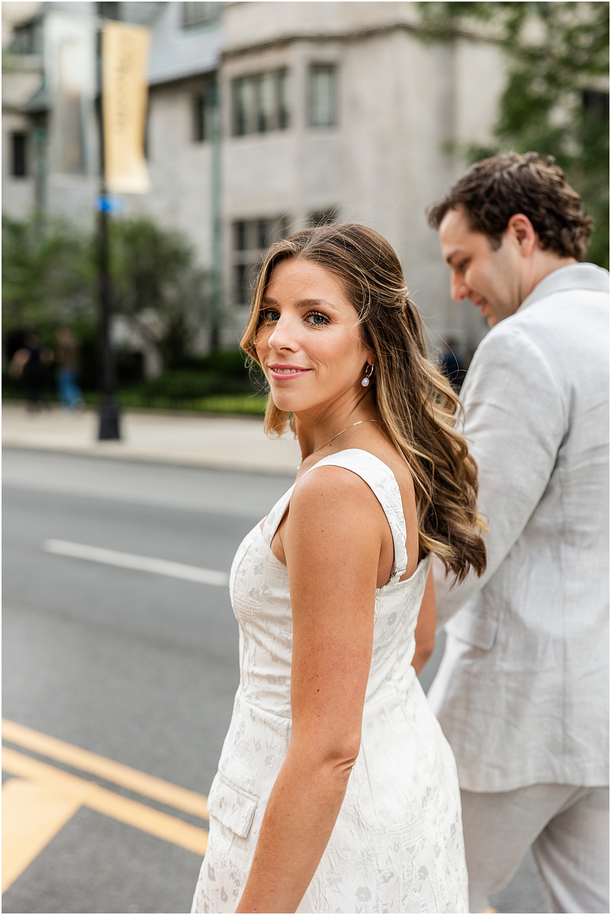 couple walk the street in downtown Chicago 