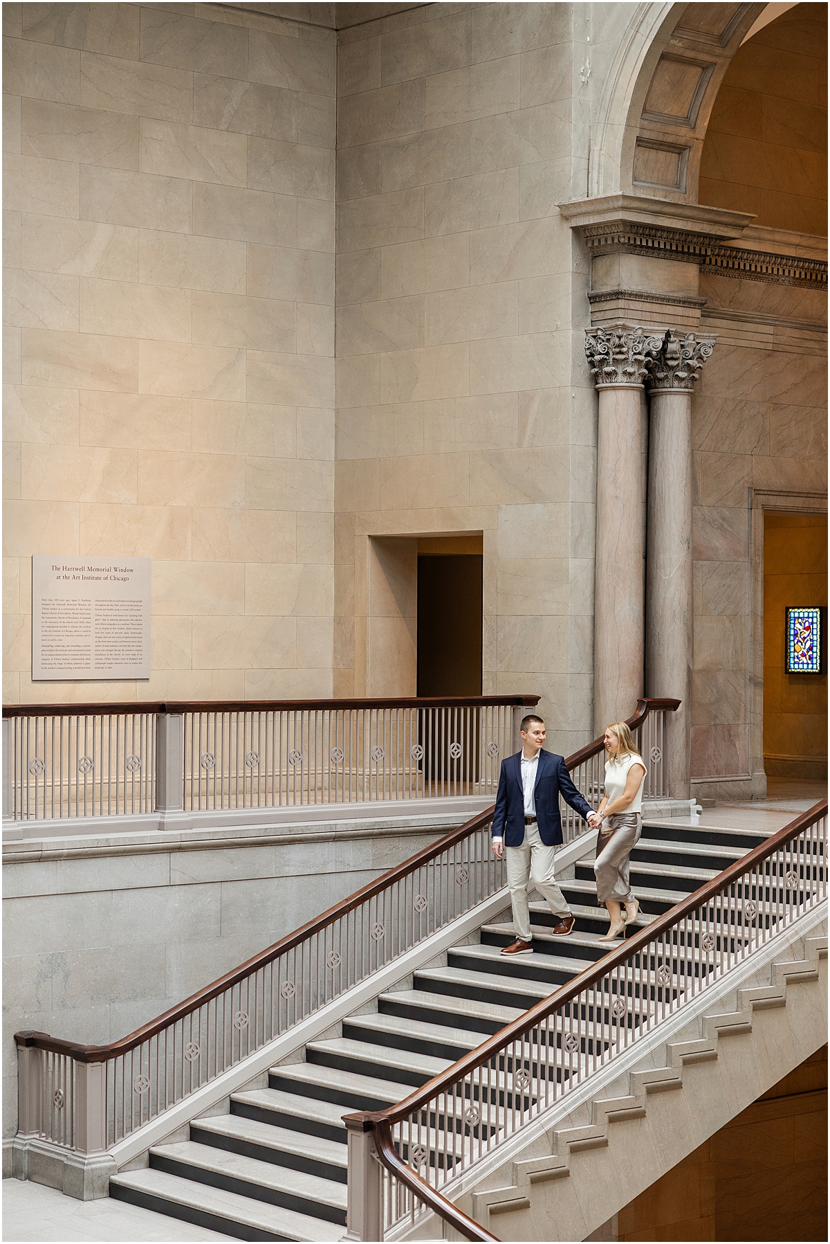 couple walk down staircase  