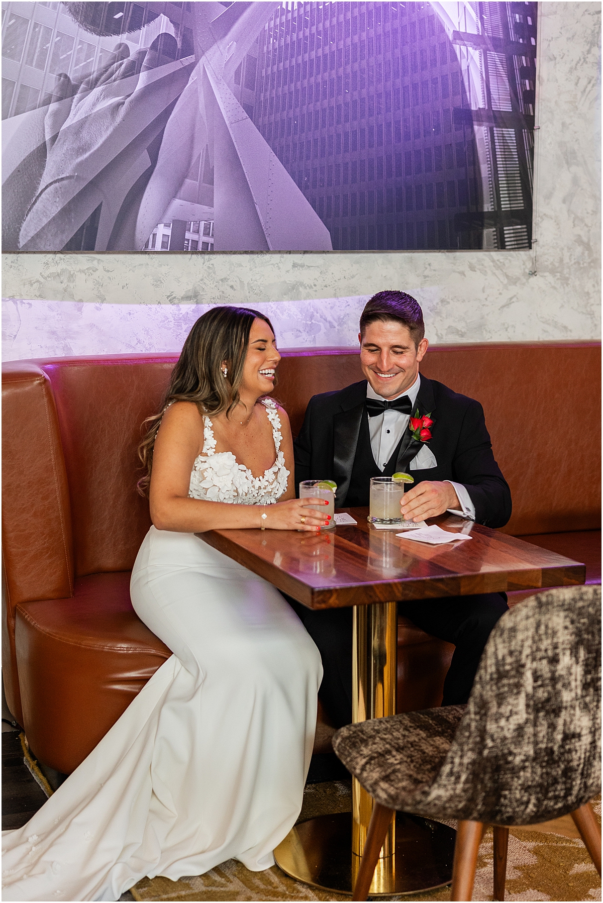 bride and groom share a pre-wedding drink together