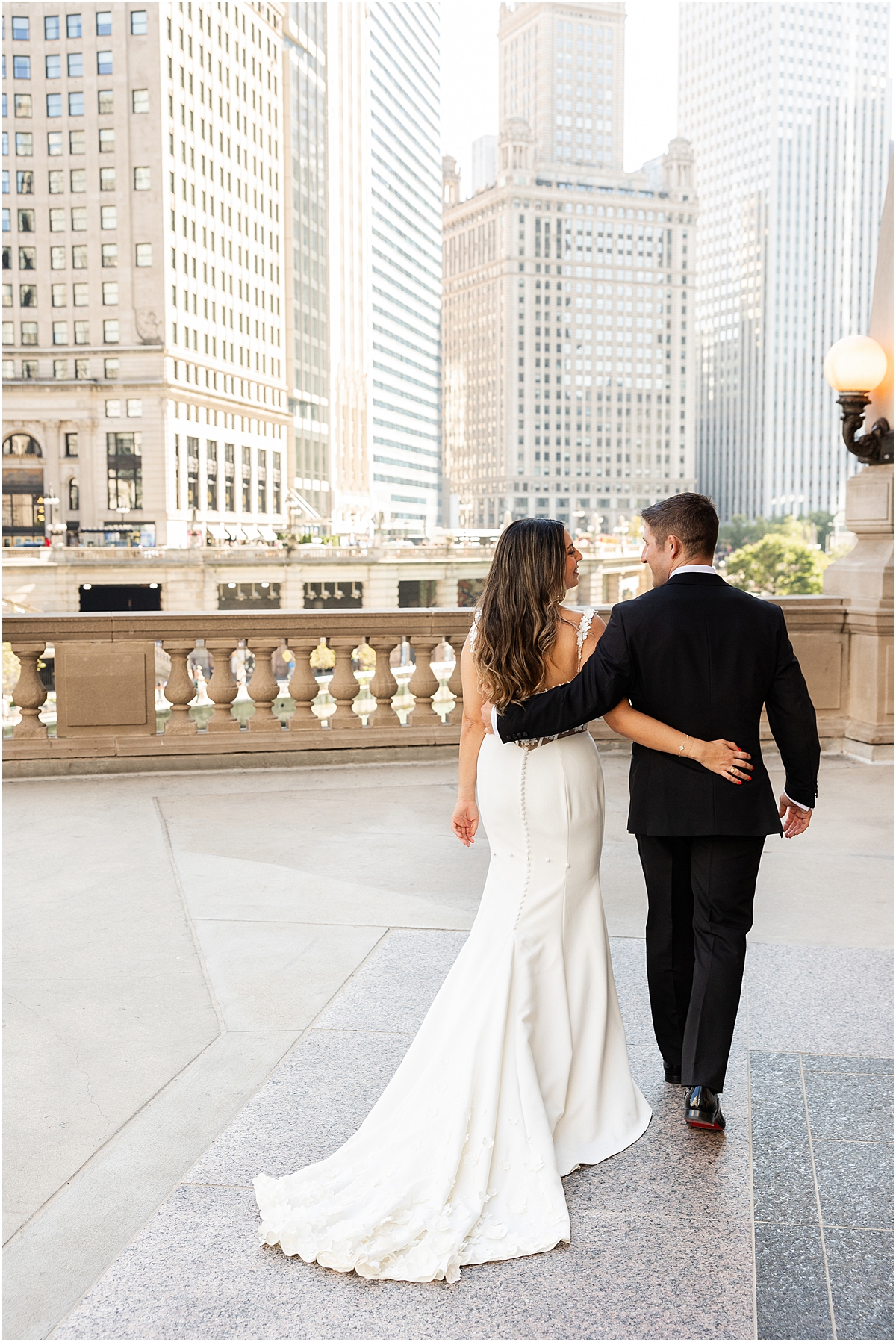 bride and groom portraits on balcony at Wrigley Building