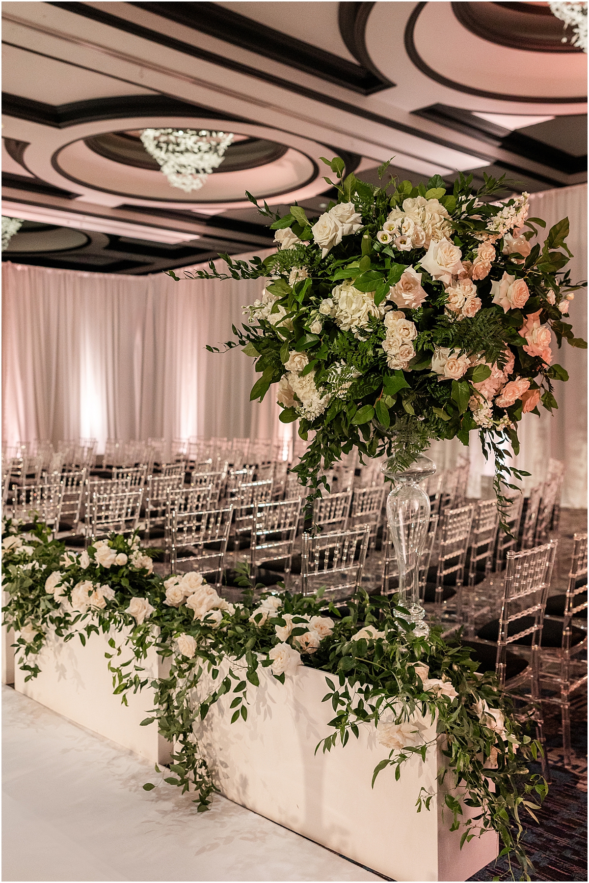 classic wedding ceremony flowers featuring white roses and greenery 