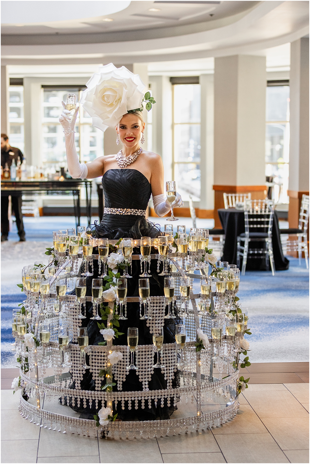 Champagne couture girls hand out champagne at cocktail hour