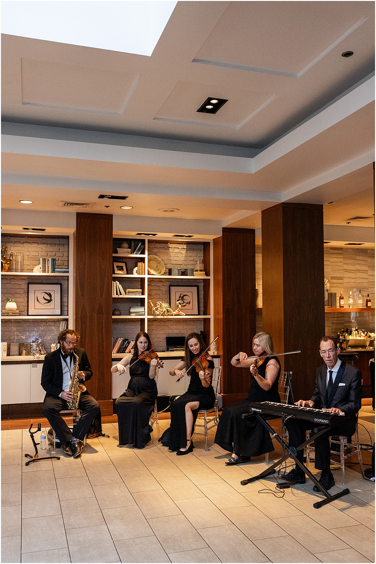 live strings play at cocktail hour