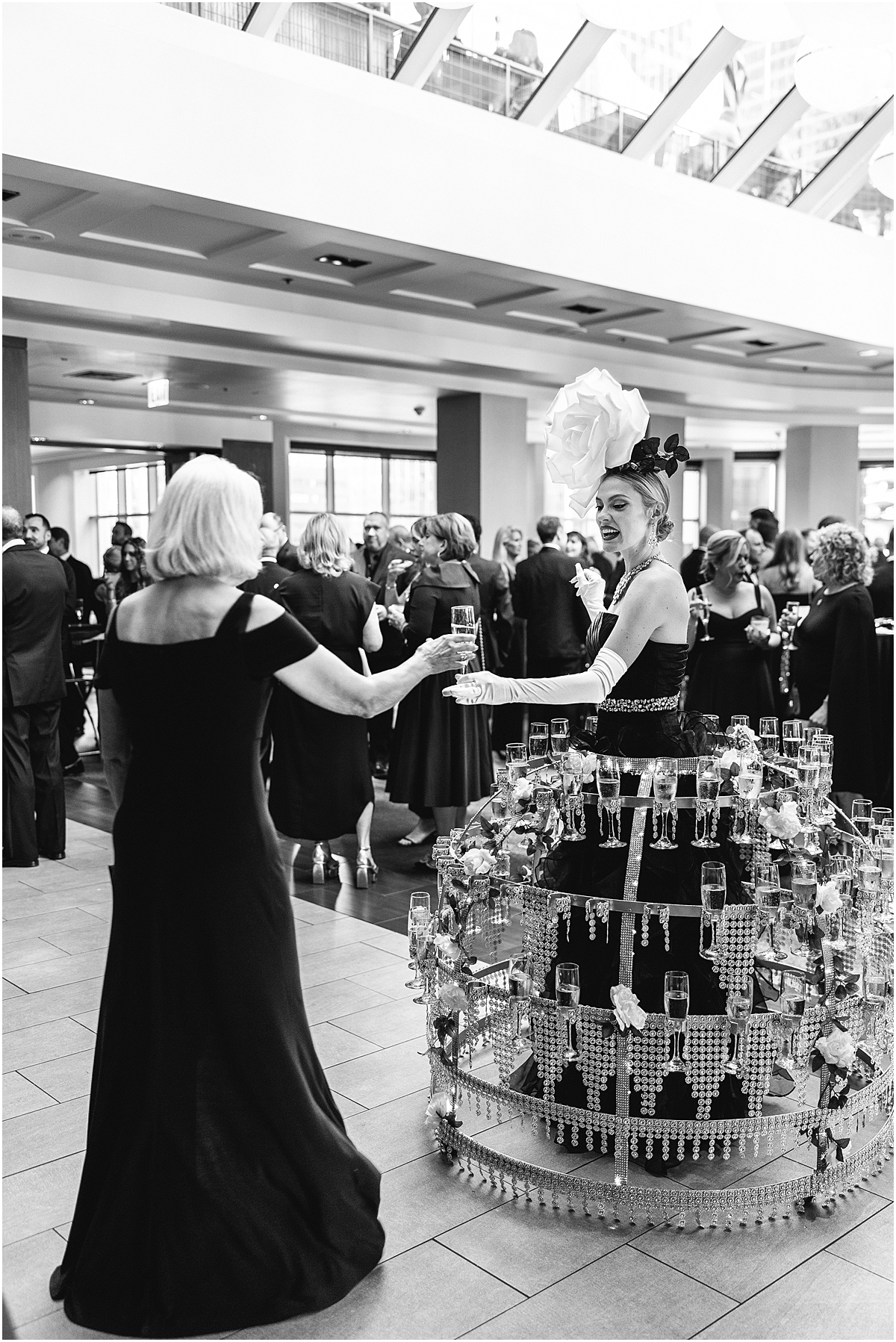 Champagne couture girls hand out champagne at cocktail hour