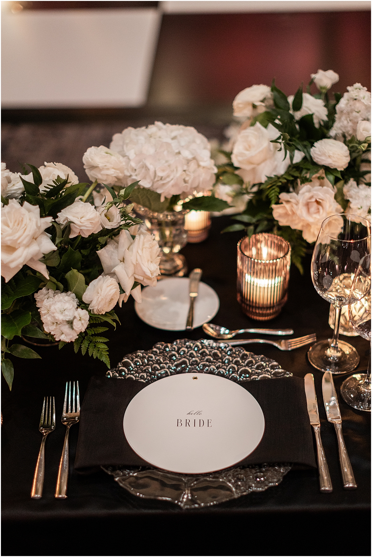 white rose centerpieces and custom menus