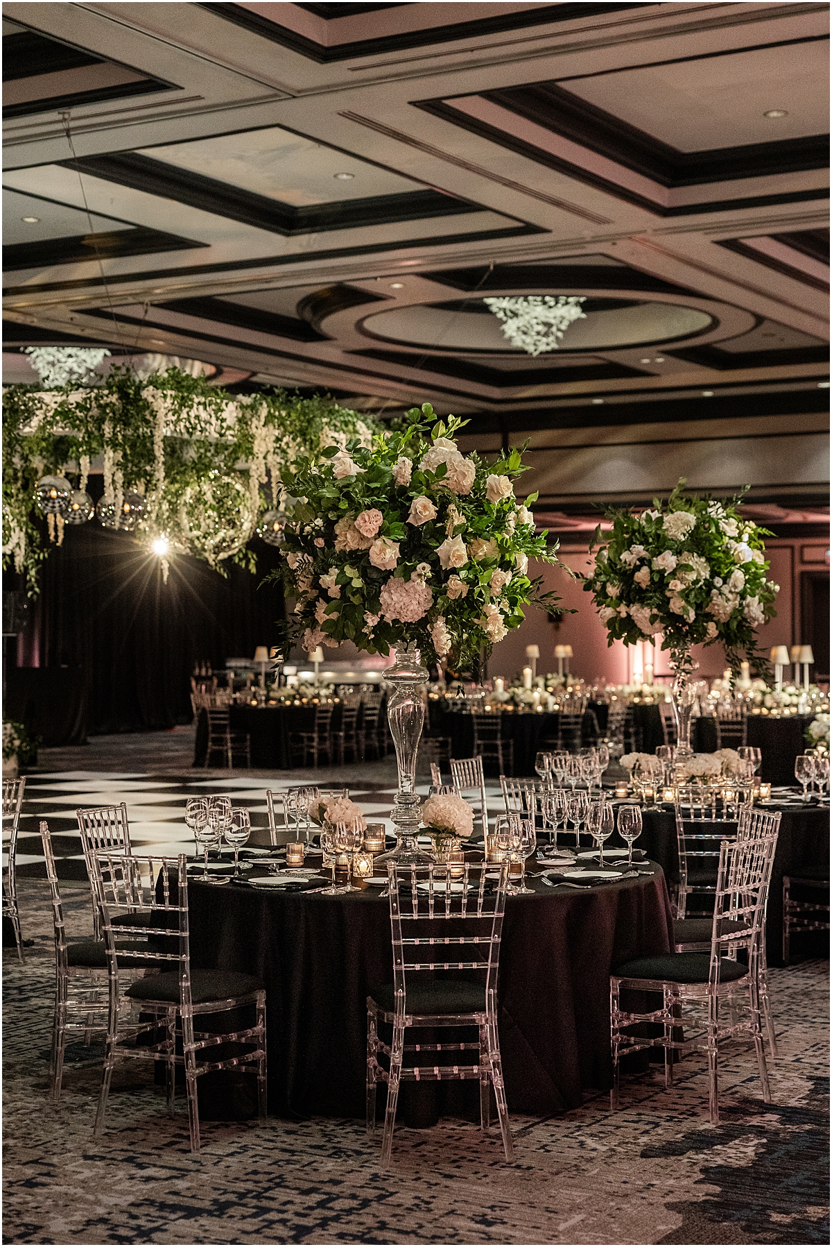classic florals with greenery and white roses decorating reception space at Chicago Renaissance Hotel