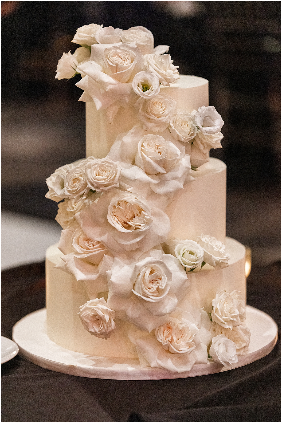 classic wedding cake with white rose details 