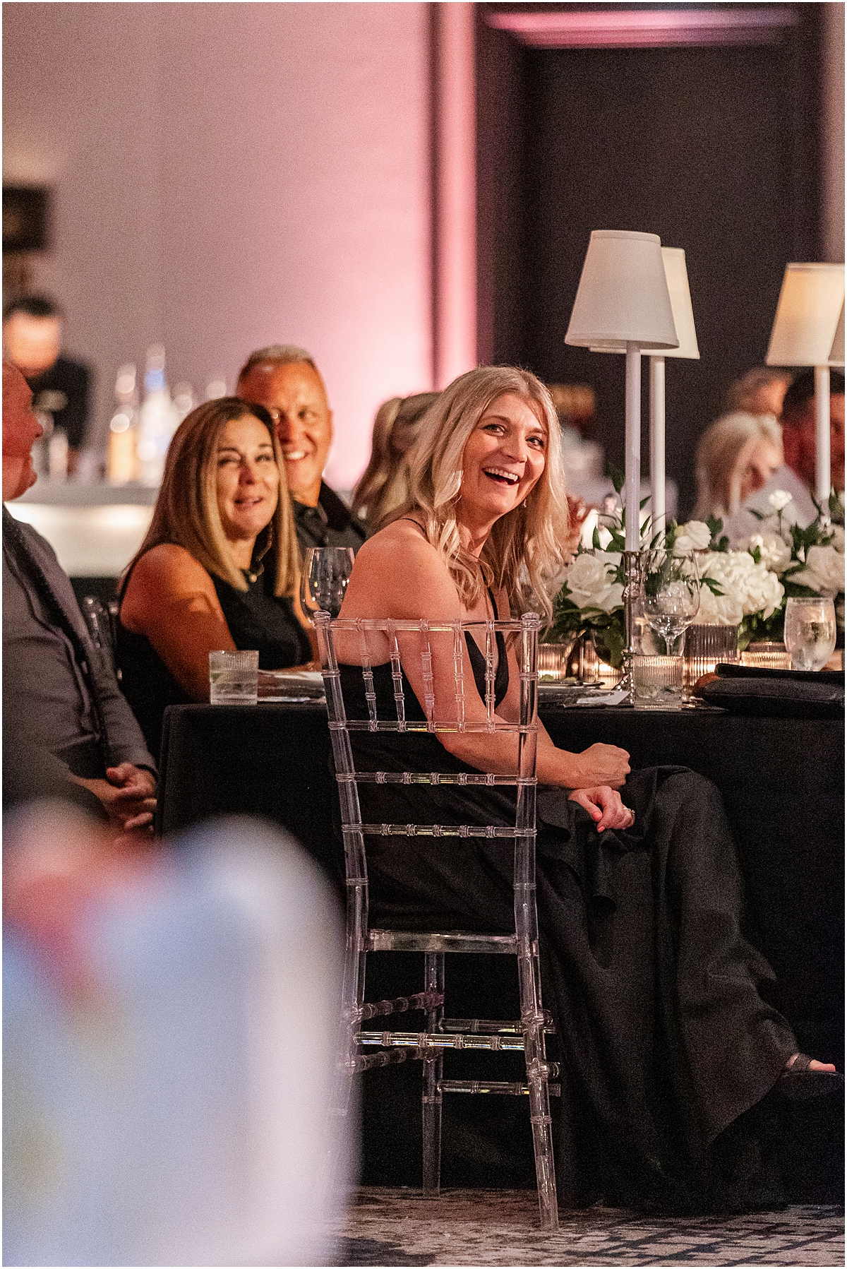 wedding guests listen to toasts