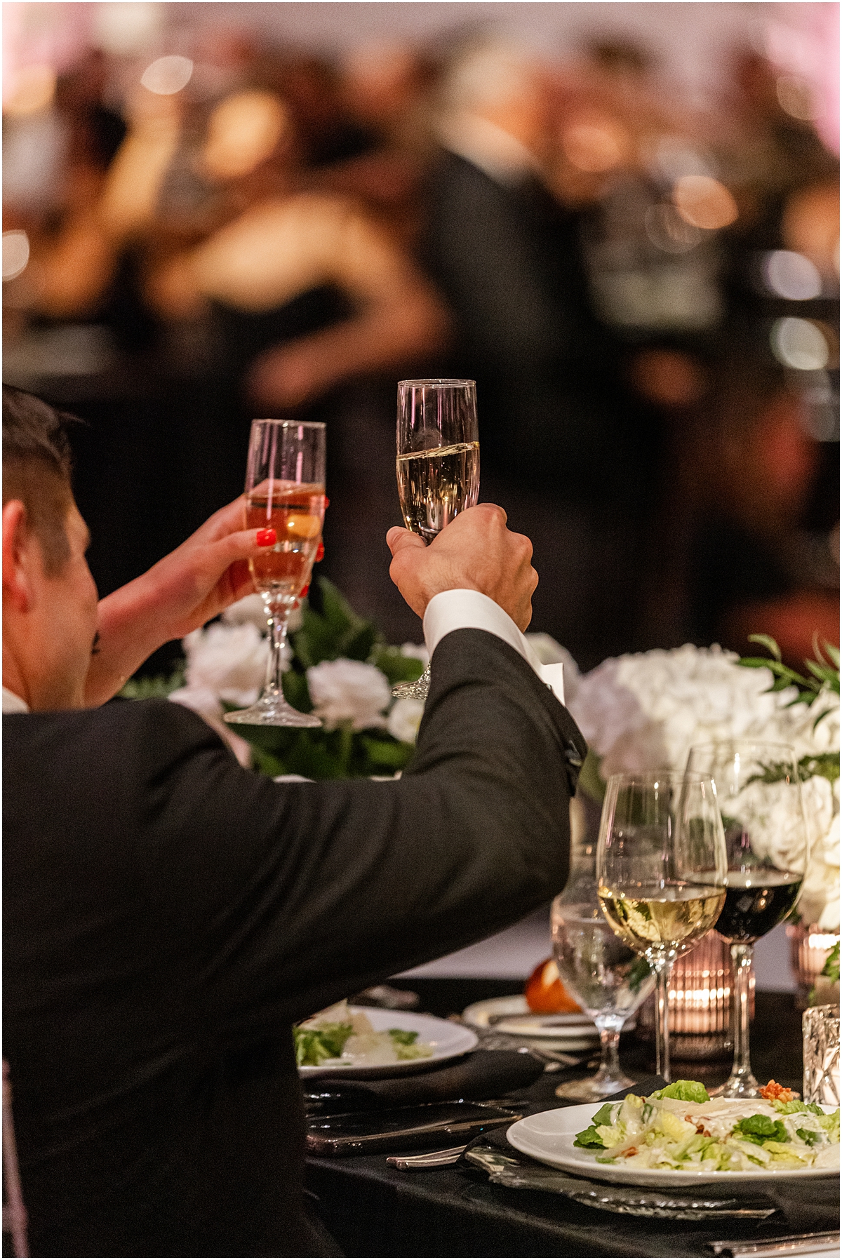guests raise their glasses to toast 