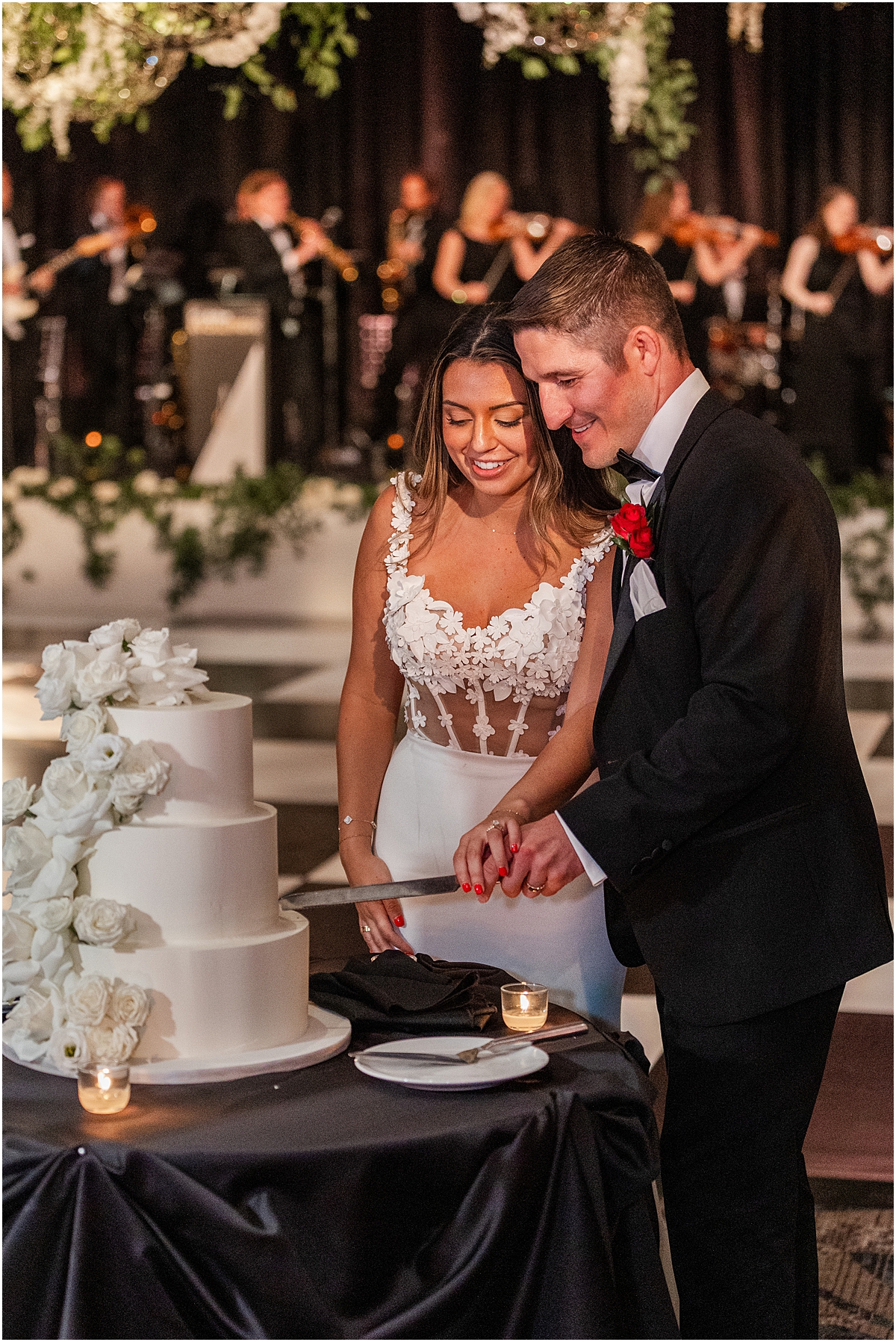 bride and groom cut wedding cake 