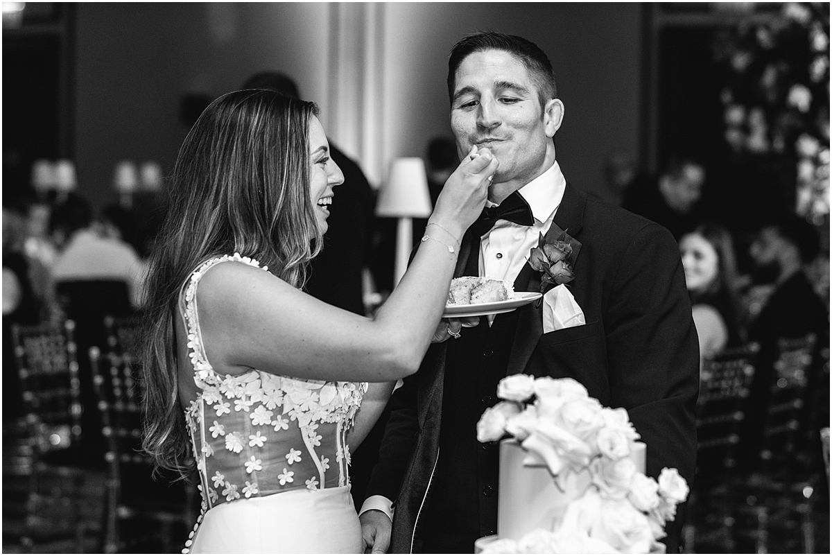bride Feeds groom wedding cake